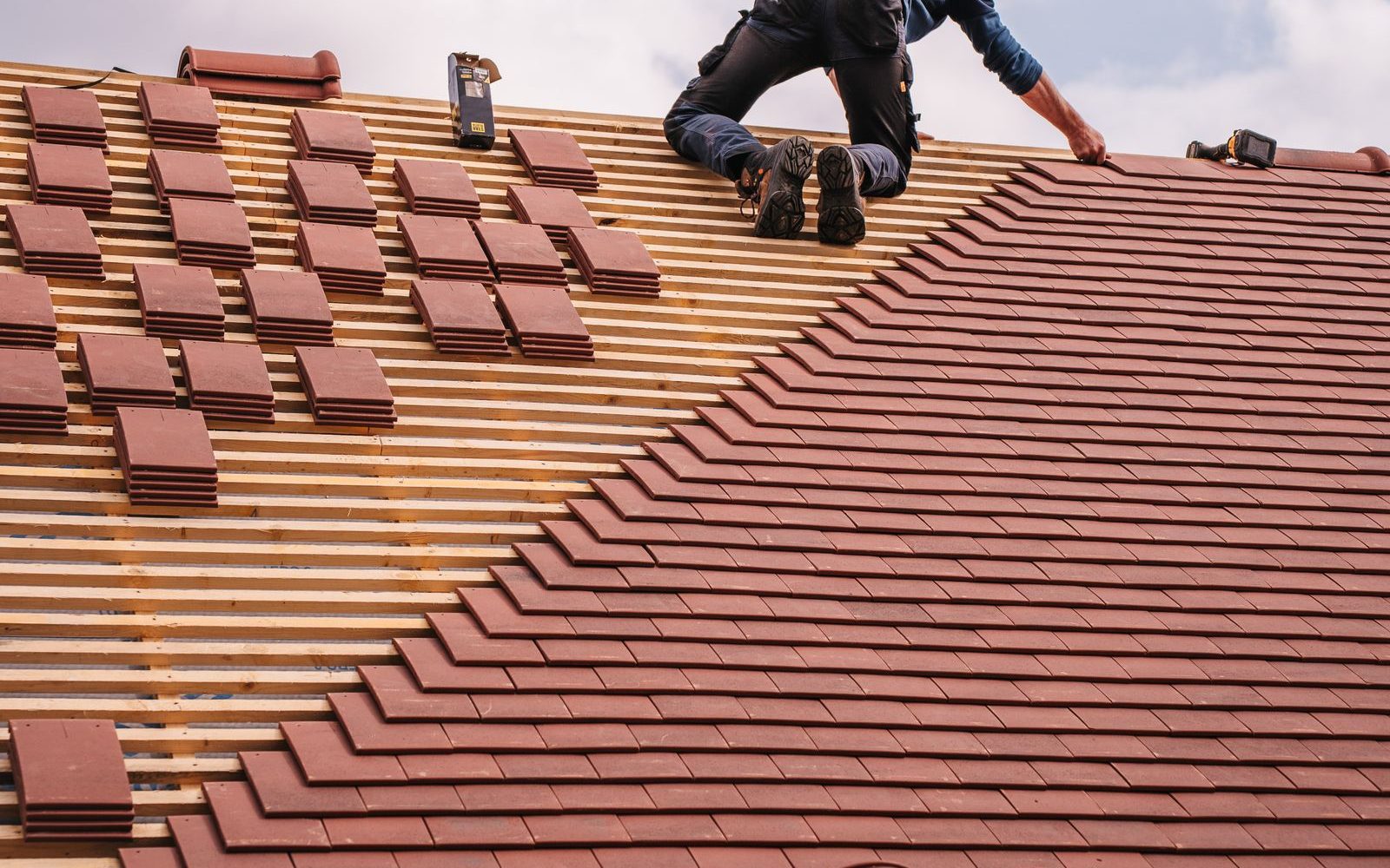 Roofer installing a residential roof
